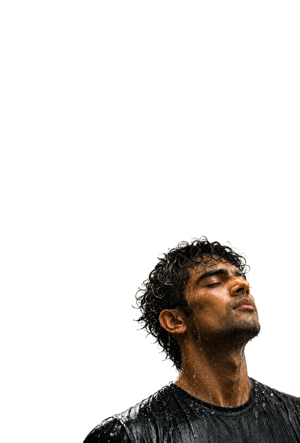Man looking up as water runs over his face